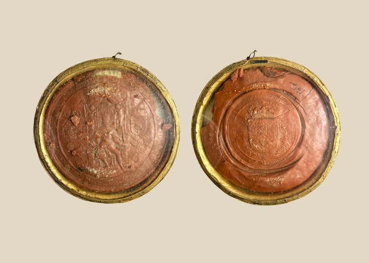 Red wax royal seal of King Philip IV of Spain, circular with detailed enthroned monarch design and Latin inscription, mounted on a white background.