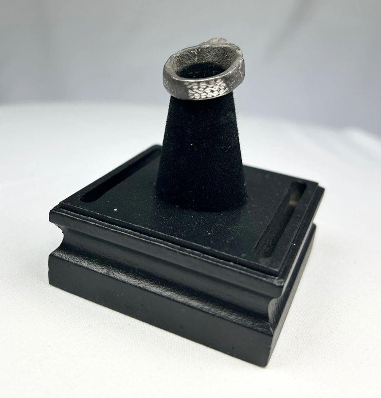 Ancient Mesopotamian silver ring with turquoise stone symbolizing divine protection