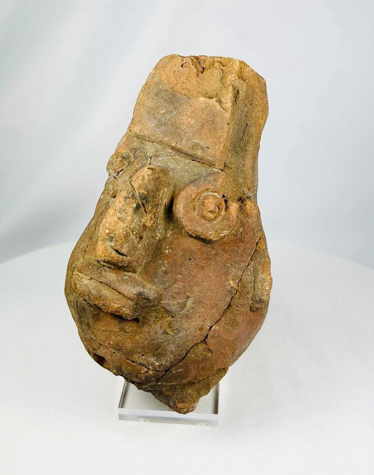 Pre-Columbian Ecuadorian terracotta head vessel showcasing craftsmanship