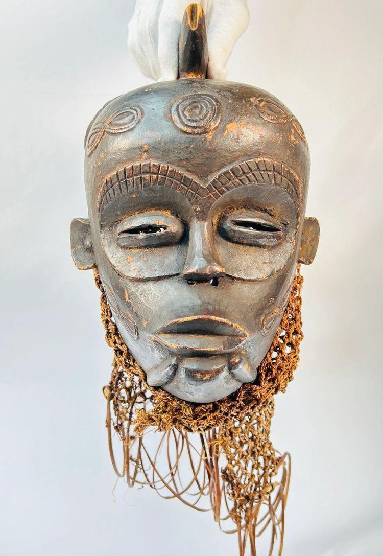 19th–20th century Chokwe ceremonial mask with detailed facial carvings