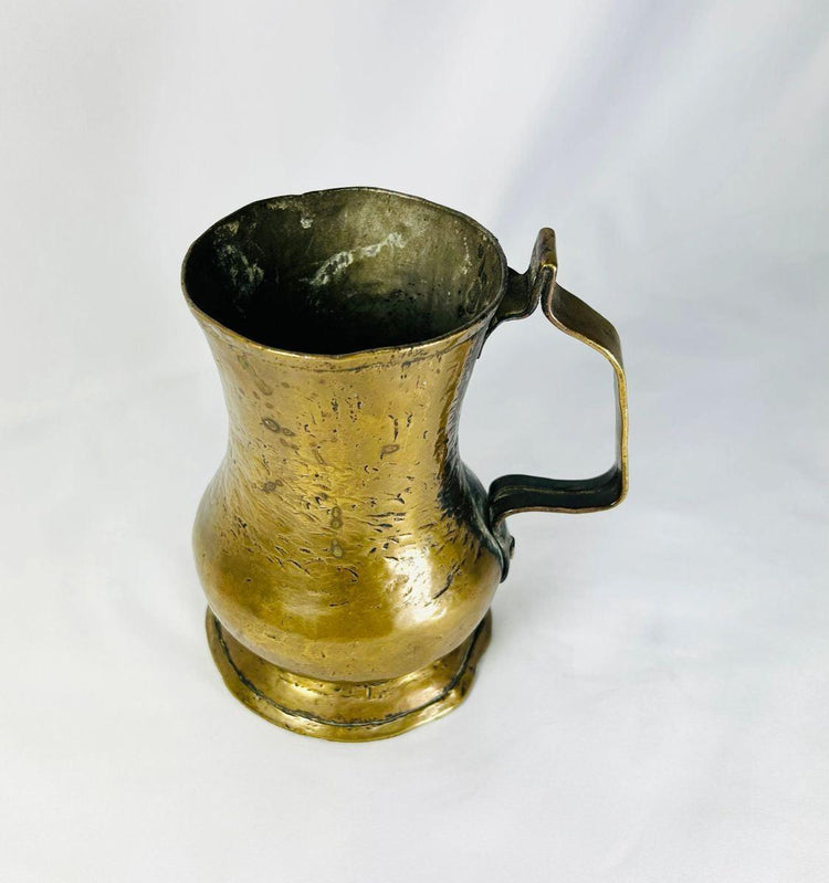 English George II period brass tankard showcasing 18th-century craftsmanship