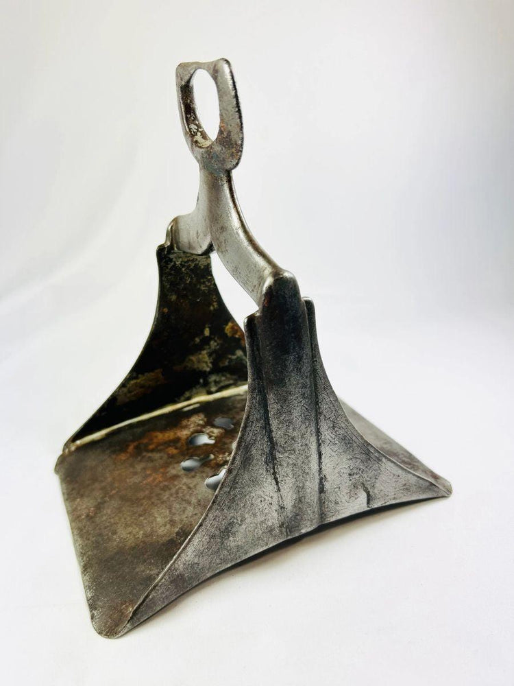 Close-up image of antique Ottoman steel stirrup displaying patina, footrest wear, and damascened silver remnants.