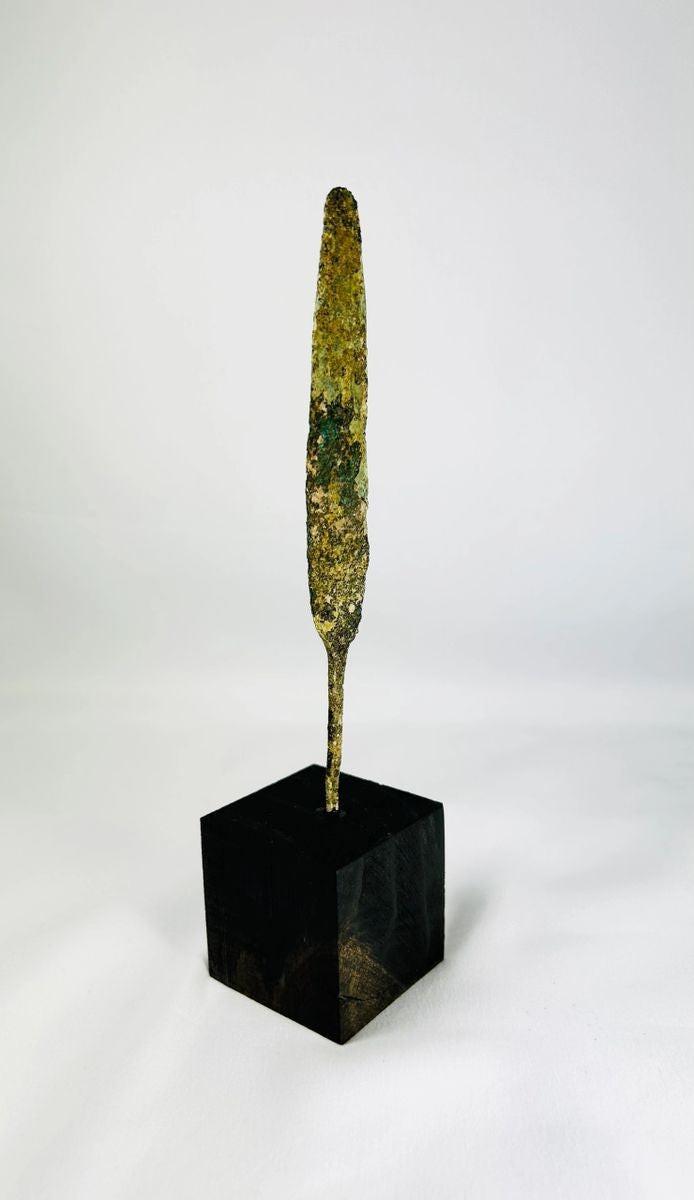 Early Bronze Age spearhead ancient weapon mounted on modern display base