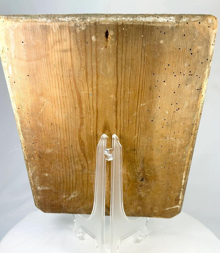 Back view of an 18th-century Russian Orthodox icon showing the aged wooden panel with natural wear and historical wormholes.