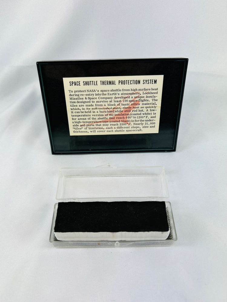 Authentic NASA Space Shuttle Thermal Protection System Tile from the 1980s, displayed in original NASA case with documentation verifying authenticity.