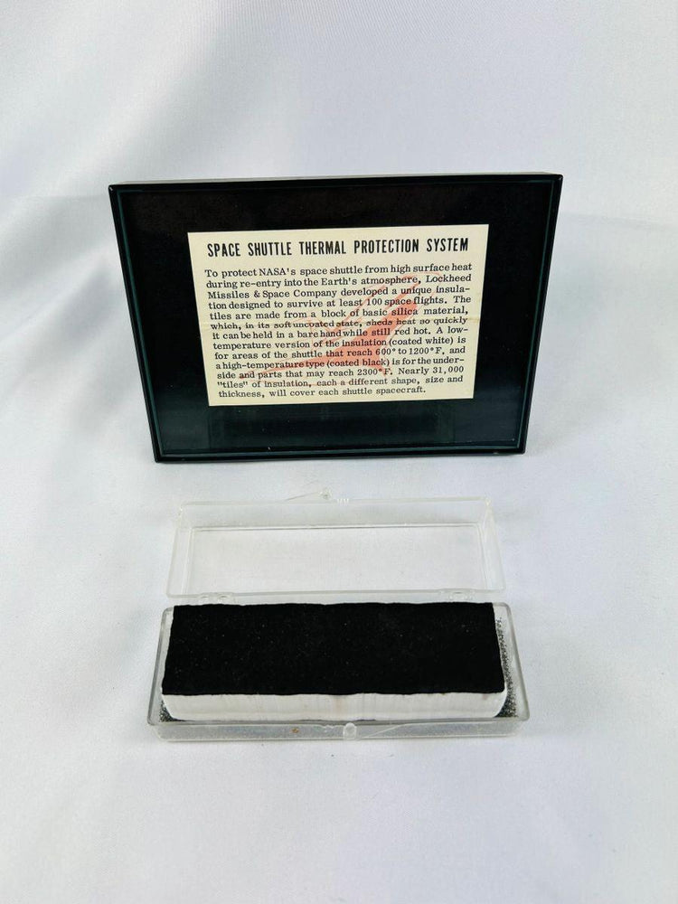 Authentic NASA Space Shuttle Thermal Protection System Tile from the 1980s, displayed in original NASA case with documentation verifying authenticity.