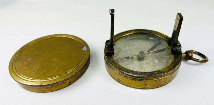 Brass folding compass from 19th-century France with sighting features