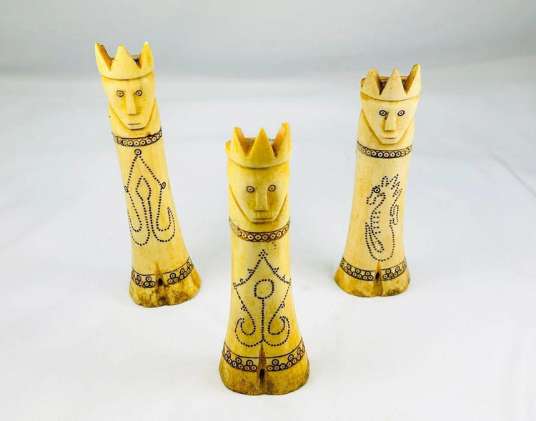 Antique betel nut lime containers from Indonesia with detailed carvings