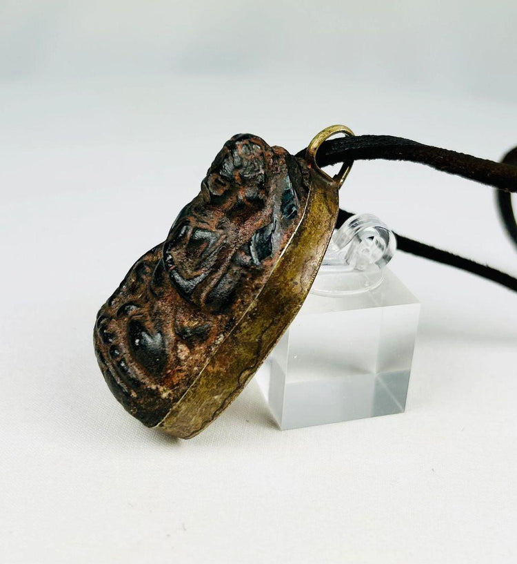 Antique shrine-style bronze Buddha pendant from Tibet/Nepal, 1880–1920