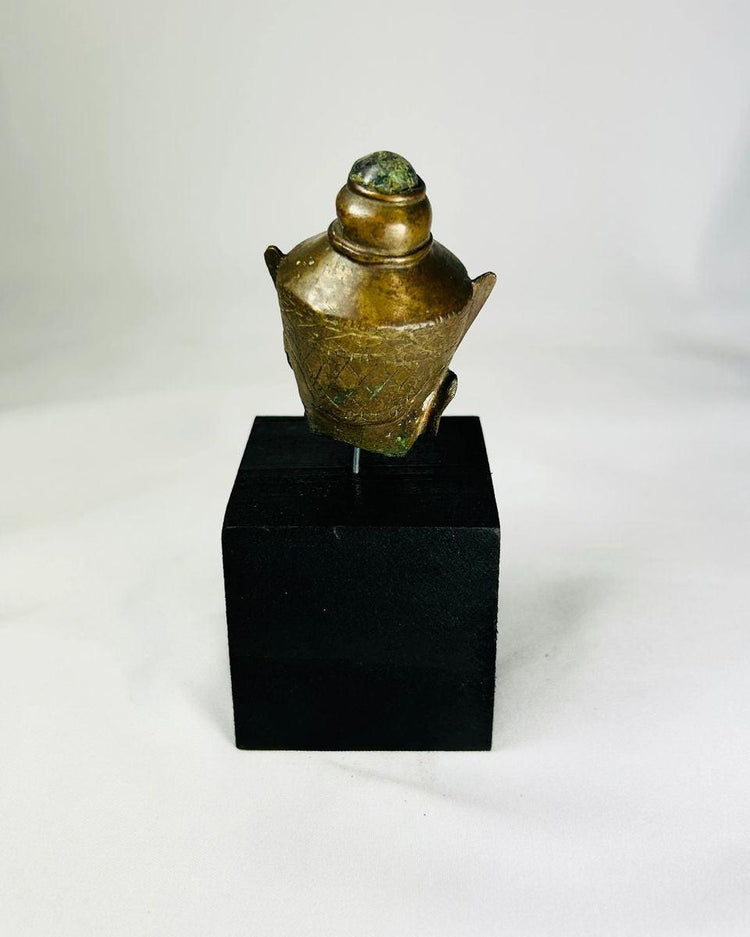18th–19th century bronze Buddha head, Thailand or Cambodia, serene expression, green patina, black display base