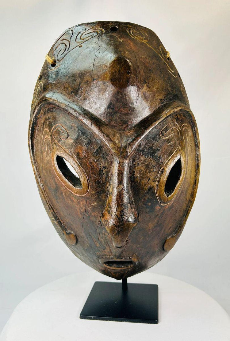 Close-up of carved eyes and nose on a Sepik River wooden mask