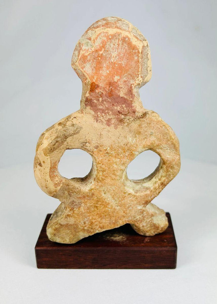 Museum-style photograph of an ancient Mauryan terracotta sculpture