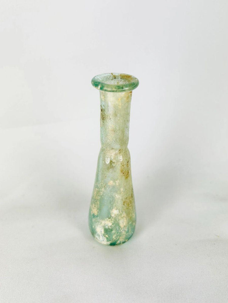 Authentic Roman glass bottle with out-sprayed folded rim and delicate translucency