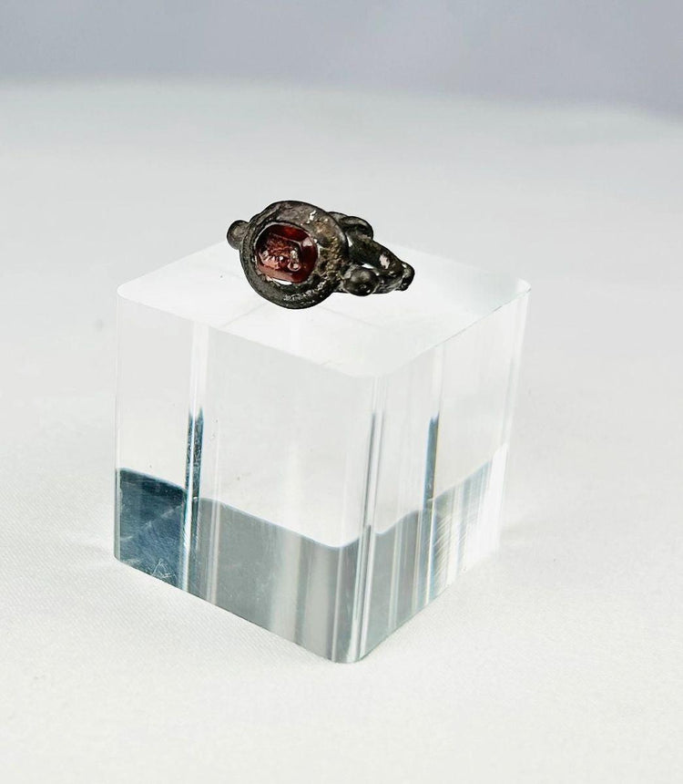 Late Roman to Early Byzantine silver ring with deep red garnet intaglio