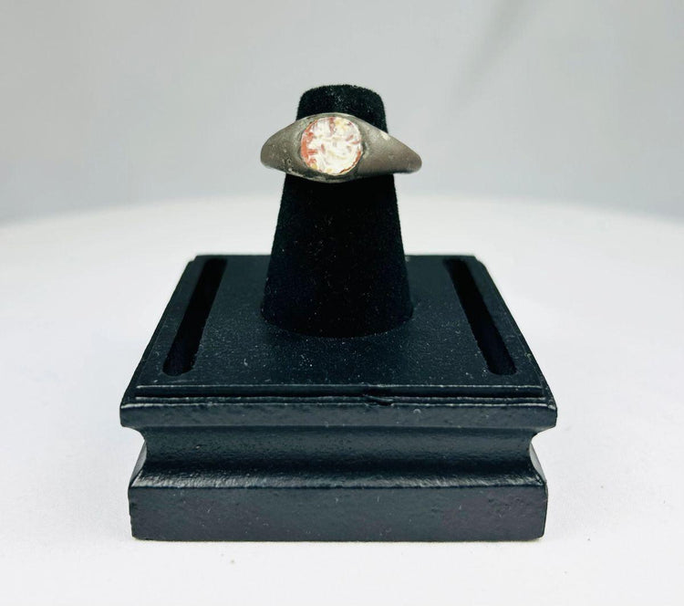 Antique silver ring with polished carnelian gemstone and engraved design