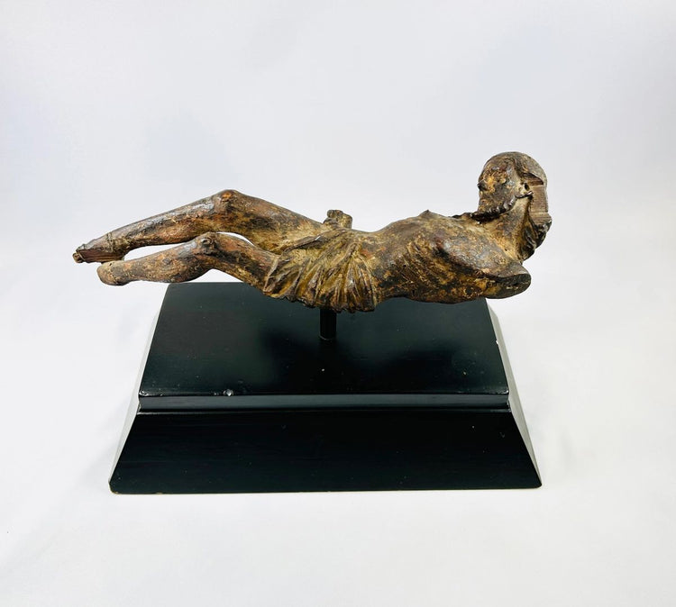 17th-century European wooden crucifix figure of Christ displayed on a black museum stand, hand-carved with natural patina — Relic & Rarity.