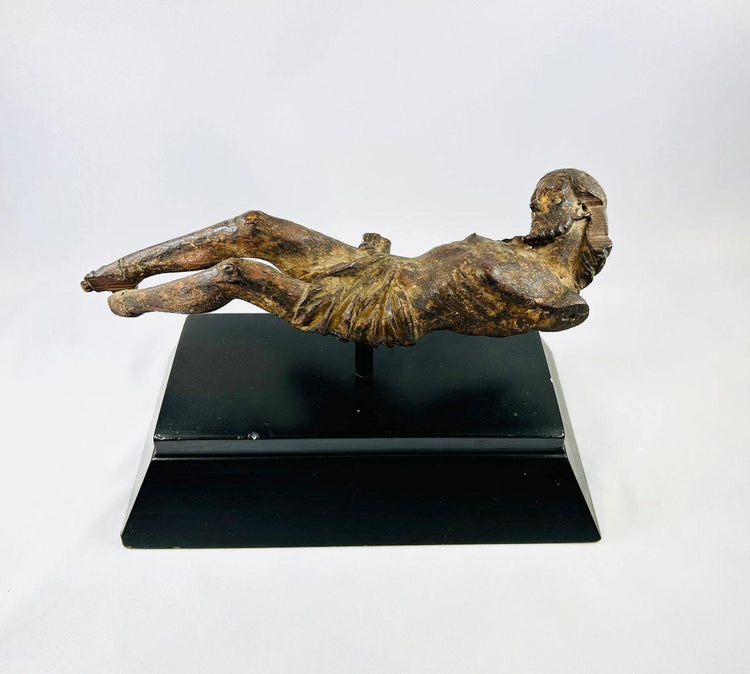 17th-century European wooden crucifix figure of Christ displayed on a black museum stand, hand-carved with natural patina — Relic & Rarity.