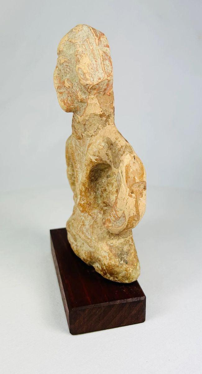 Side view of a Mauryan era terracotta figure highlighting form and proportions