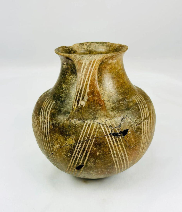 3000–2000 BCE terracotta jug used for ceremonial offerings or storage