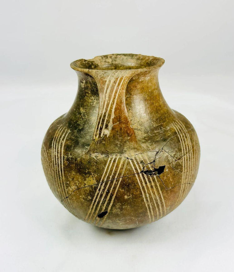 3000–2000 BCE terracotta jug used for ceremonial offerings or storage