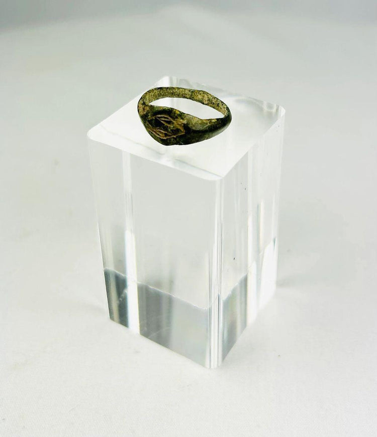 Close-up of engraved intaglio design on Roman bronze ring bezel.