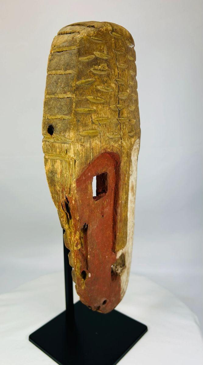 20th-century Papua New Guinea Sepik River ritual mask with split face
