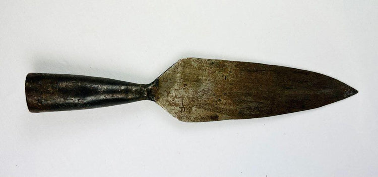 18th-century Indo-Persian spearhead with long leaf blade and patina, photographed flat.