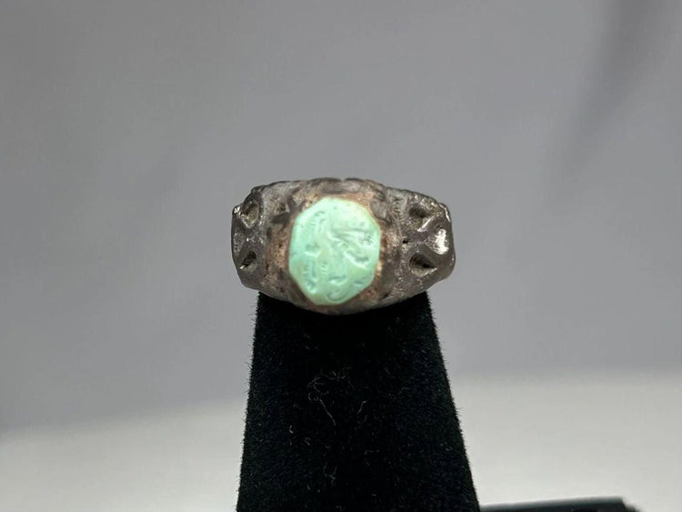 Mesopotamian silver ring depicting winged serpent and mythical creatures on silver band