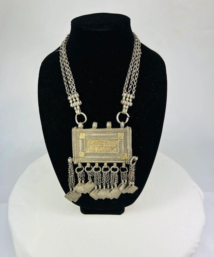 Antique Omani silver necklace featuring central rectangular Koran holder