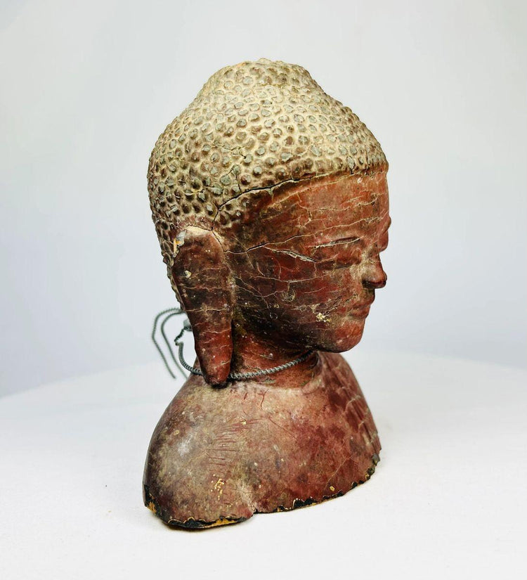 Full bust photograph of 19th-century Southeast Asian Buddha in carved and lacquered wood.
