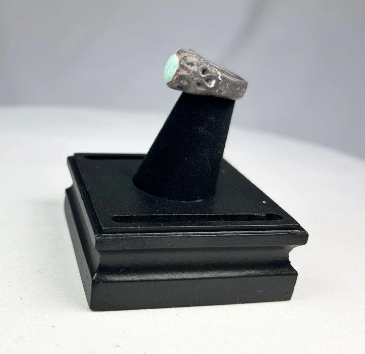 Neo-Assyrian silver ring featuring engraved winged serpent and mythical beast motifs