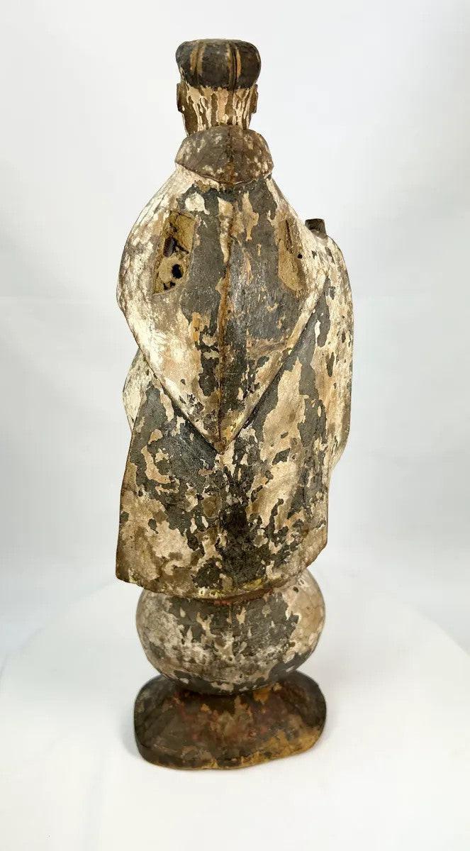 Hand-carved Spanish Colonial santo figure with tonsured hair and simple robed attire, dating to the 17th–18th century.