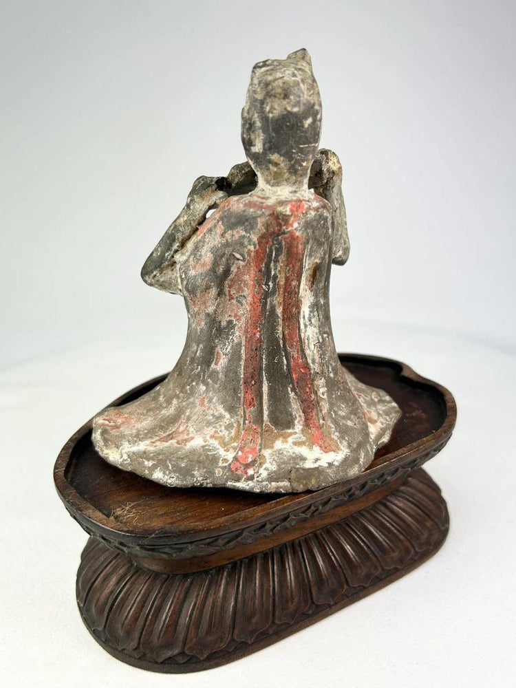 Seated Tang Dynasty female musician playing pan flute terracotta figure