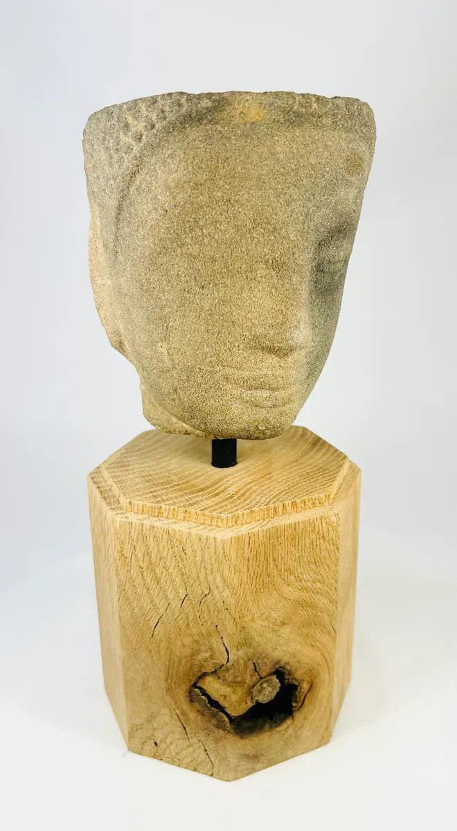 Frontal view of Khmer Sandstone Buddha Head Fragment from 12th-Century Angkor Period Cambodia, mounted on wooden display base – ancient Southeast Asian Buddhist sculpture – Relic and Rarity.