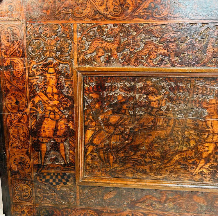 Renaissance hardwood carving with heraldic emblem and allegorical figure, detailed 16th–17th century craftsmanship.