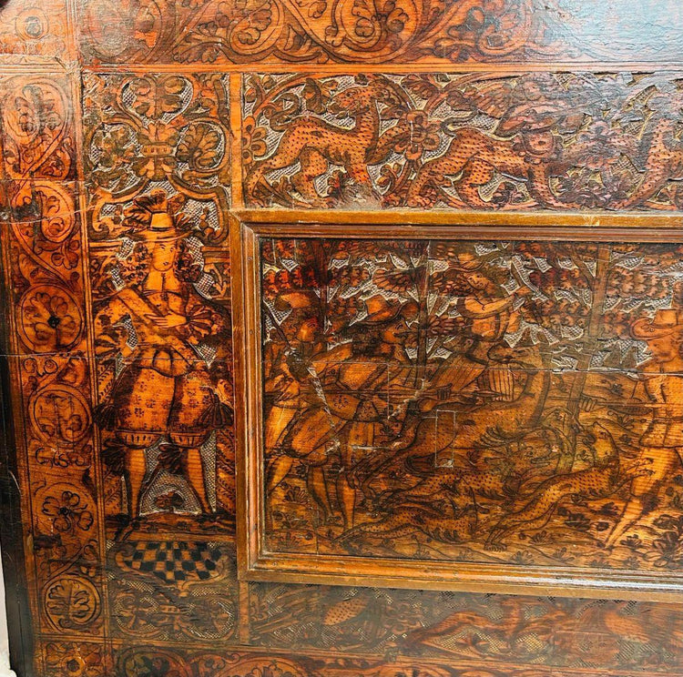 Renaissance hardwood carving with heraldic emblem and allegorical figure, detailed 16th–17th century craftsmanship.
