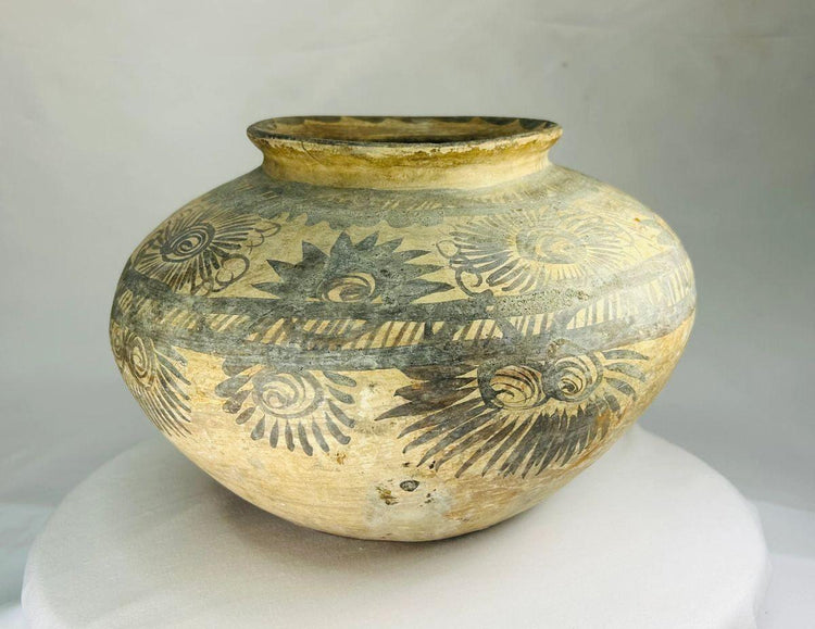 Neolithic European painted terracotta vessel with spiral and sunburst motifs, bulbous body and narrow rim, circa 5500–4500 BCE, associated with the Linear Pottery or Vinča culture.