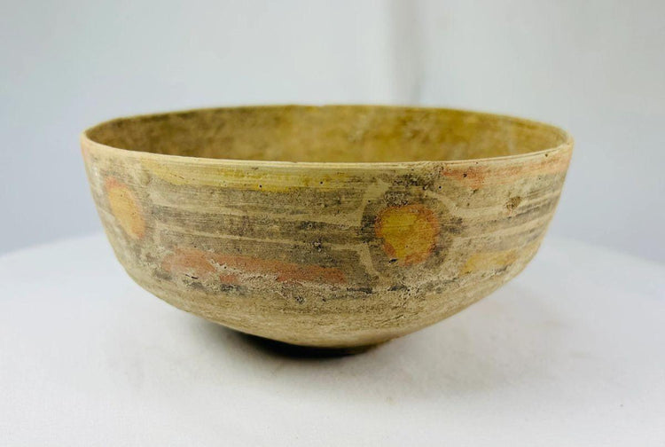 Two Indus Valley ceramic bowls, one plain and one decorated with polychrome