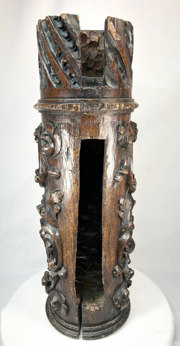 Historic Japanese shrine pillar carving featuring floral and scrollwork designs