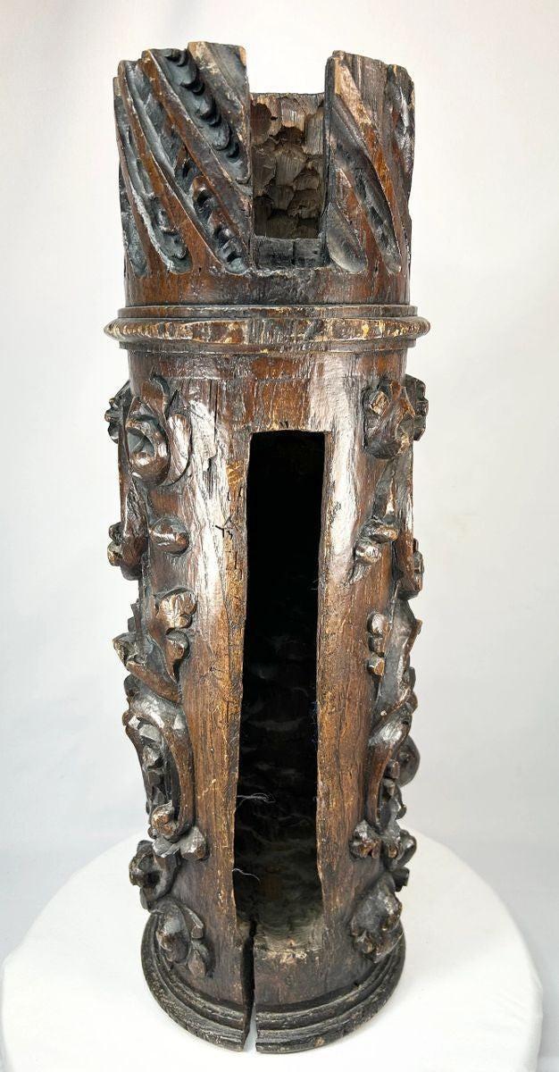 Historic Japanese shrine pillar carving featuring floral and scrollwork designs