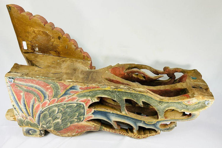 Side view of Qing Dynasty phoenix relief hand-carved from camphor wood with polychrome and gilded details, showing layered carving and symbolic Fenghuang design – Relic and Rarity.