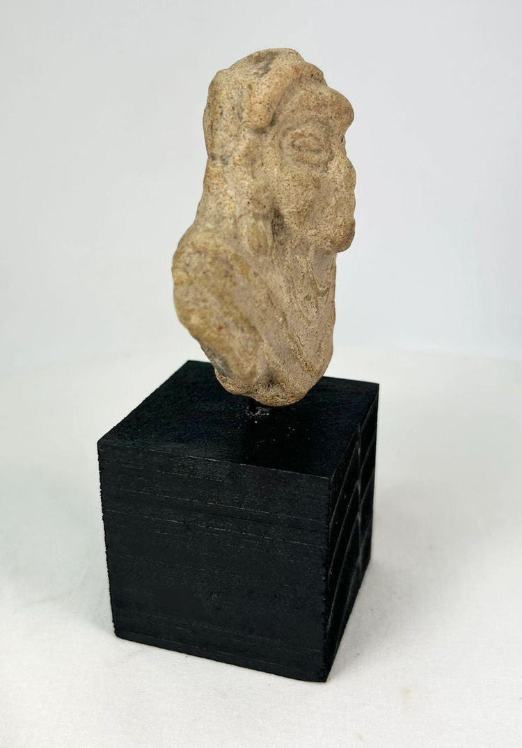 West Mexican or Roman terracotta figure fragment with almond eyes and nose