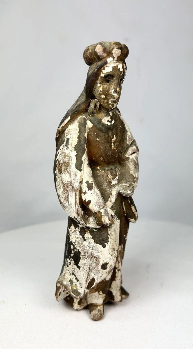 Carved wooden Spanish Colonial religious santo with traces of gold and paint, open-hand gesture and aged surface patina, mounted on original base.