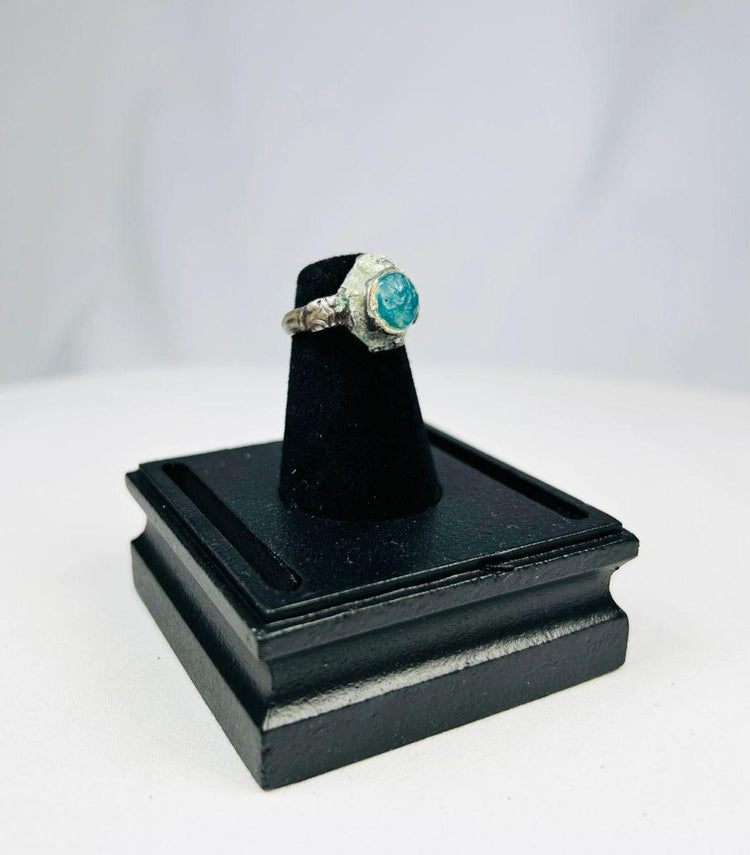 Antique Near Eastern silver ring symbolizing nobility and strength with turquoise accent