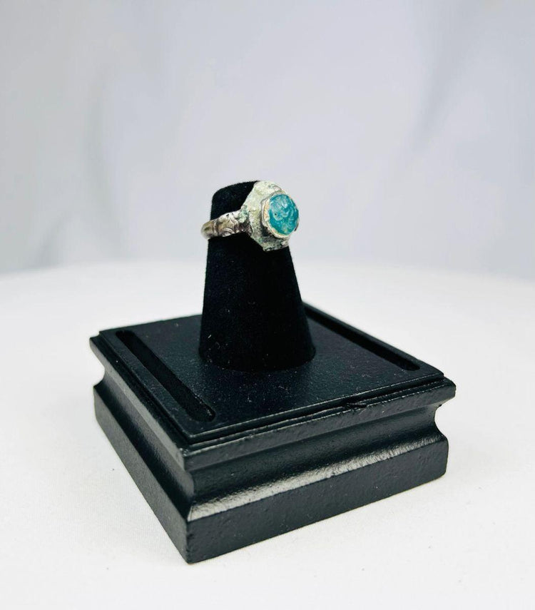 Antique Near Eastern silver ring symbolizing nobility and strength with turquoise accent