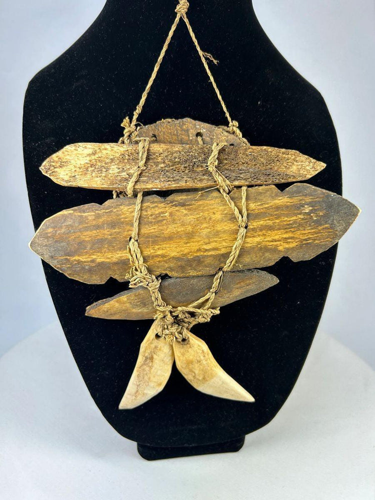Hand-carved Lega tribal bone pendant mask from Congo with cord