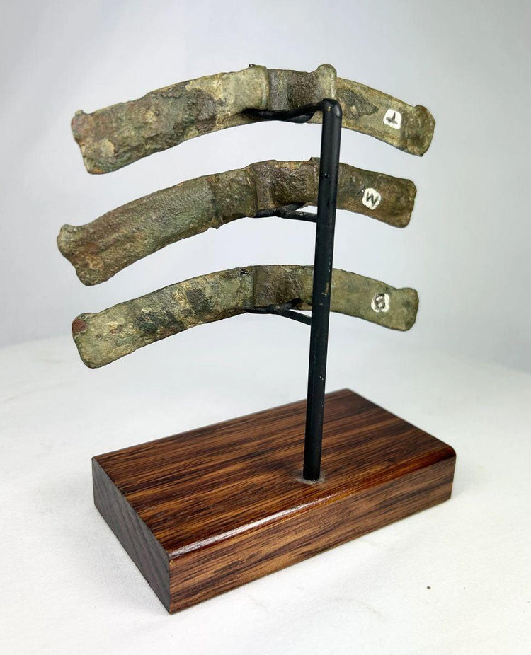 Antique Chinese bronze chariot mounts with inscriptions and aged patina