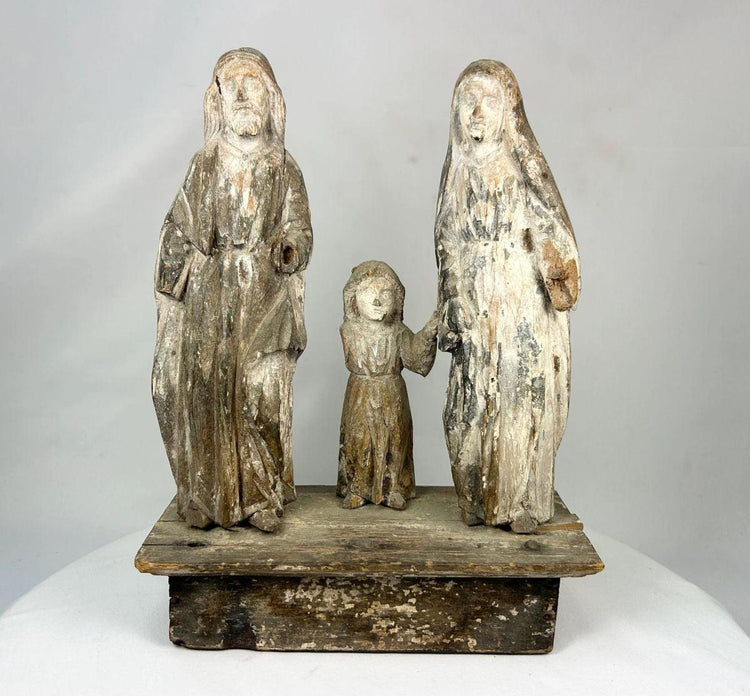 Carved wooden Spanish Colonial Holy Family santo on display