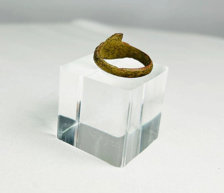 Macro image showing texture and corrosion patterns on an ancient bronze ring