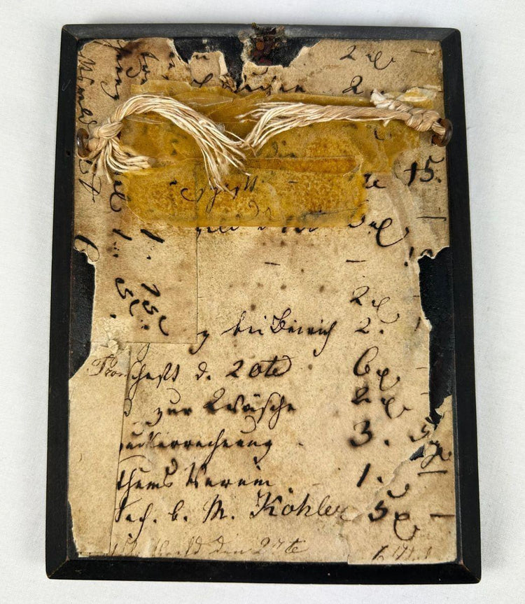 Reverse view of the ebonized frame and backing of a miniature portrait